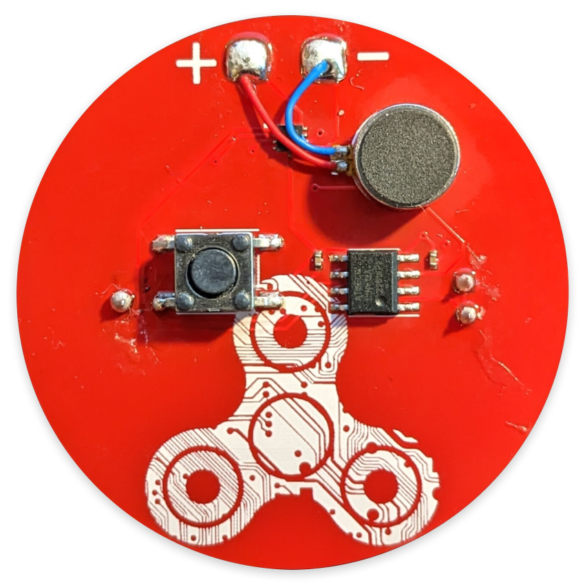A red circular circuit board with a graphic of white fidget spinner on it.